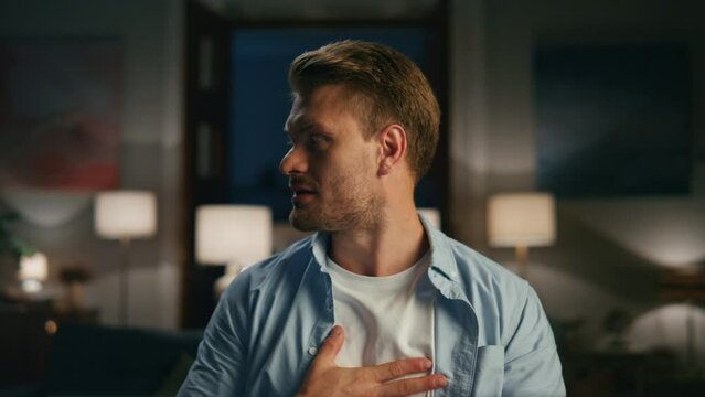 Nervous man annoyed computer at dark room closeup. Wife dancing at background