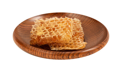 Honeycomb in wooden plate on transparent background.