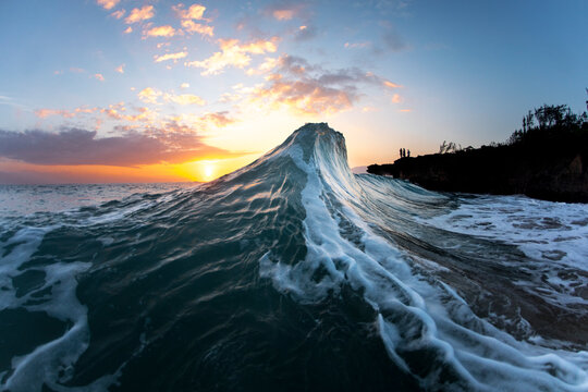 Wave in sea at sunrise, Oahu, Hawaii, USA
