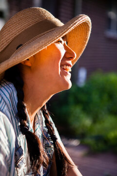Portrait of smiling Japanese American woman wearing hat
