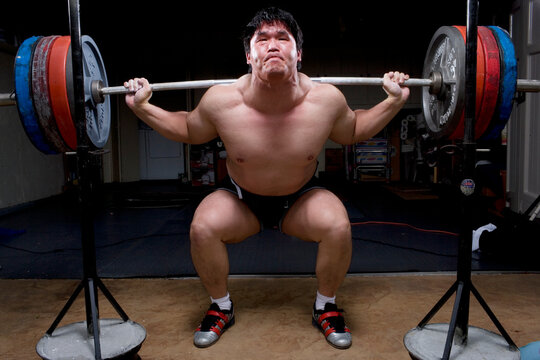 A weight lifter training.