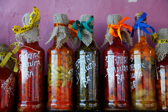 Colorful preserved fruits vegetables and chilli peppers souvenirs, Arraial d'Ajuda, Bahia, Brazil.