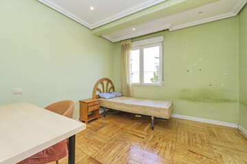 Old and dirty bedroom without sheets on the individual mattress