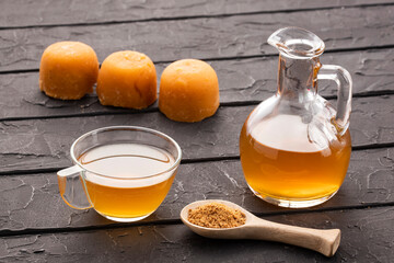 Typical Colombian drink aguapanela - Sugarcane panela drink