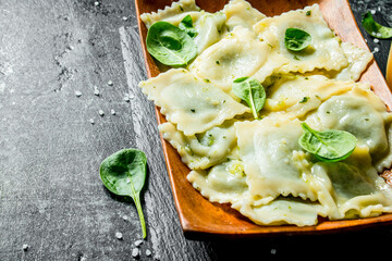 Ravioli with greens on a plate.