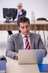 Two male colleagues working in the office