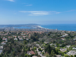Fototapeta na wymiar Aerial view over La Jolla Hills with big villas and ocean in the background, San Diego, California, USA