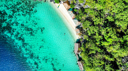 Drone Aerial of Pretty Girl Floating in Crystal Clear Blue Water at Beach In Tropical Paradise, Palawan, Philippines 4