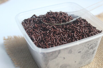 lots of chocolate meses in plastic boxes