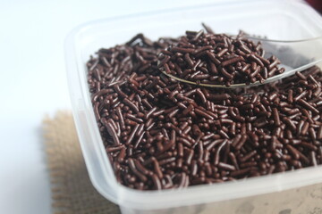 lots of chocolate meses in plastic boxes