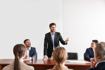 Business conference. People in meeting room listening to speaker report