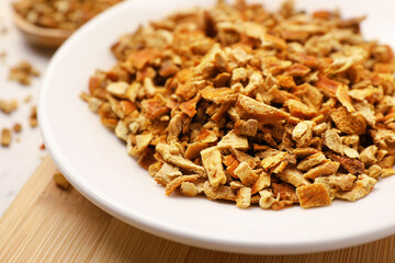Plate with dried orange zest seasoning on plate, closeup