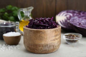 Obraz na płótnie Canvas Tasty red cabbage sauerkraut and different ingredients on table