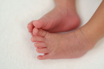 close up feet of newborn baby