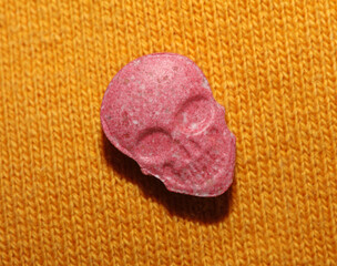 Obraz na płótnie Canvas Purple skulls world's strongest ecstasy pills with mdma close up background high quality big size dope prints