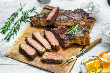 Grilled beef steak with rosemary and spices.