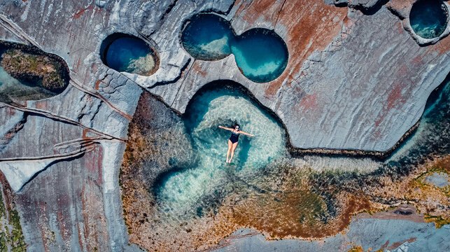 Pretty Girl Floating In Famous Figure 8 Pools In Royal National Park, Australia