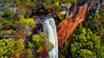 Aerial of Waterfall Cascade of Beautiful Fall Foliage Around Fitzroy Falls in Morton National Park, Australia