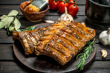Grilled ribs with sauce, herbs and spices.