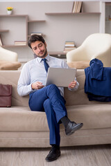 Young male employee working from home during pandemic