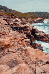 Naklejka premium Sandstone Swirls in Rock at Putty Beach, Australia