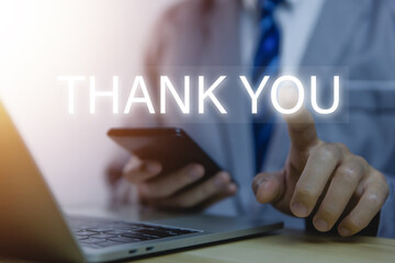 Man touches the smartphone and sends message words to thank you.	