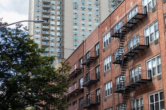 Row of Old Apartment Buildings with Fire Escapes on the Upper East Side of New York City