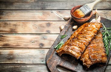 Grilled ribs with rosemary, spices and sauce.