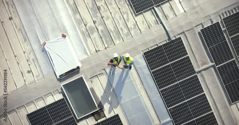 Poster Solar energy, drone and construction workers on rooftop for engineering, architecture or grid. Aerial view, solar panels and industrial team working on project management, city logistics and building