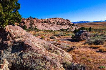 Granite outcrop at Split Rock roadside park with sagebrush, sand and pine trees