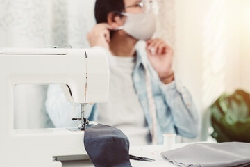 The man sewing face mask