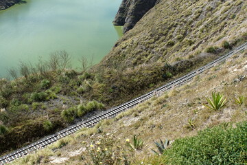 Train tracks running along the rim of Laguna de Yambo, near Latacunga, Ecuador