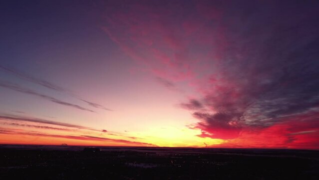 Flying drone in Calgary during a beautiful sunrise over the mountains in winter
