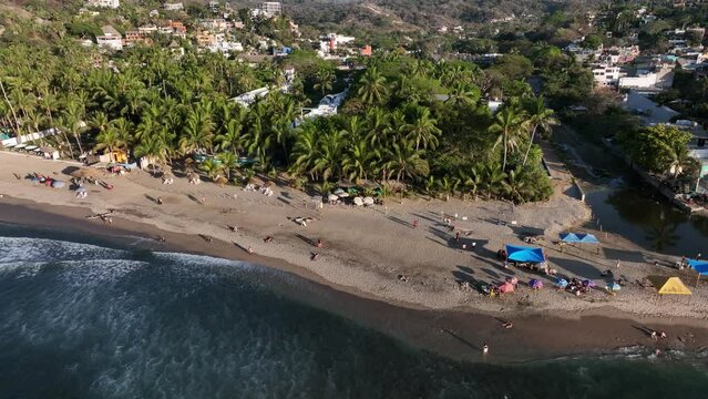 Sayulita, Mexico's main beach and town. Establishing Aerial Fly Drone View.
