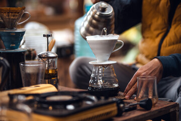 Closeup of hands barista make coffee