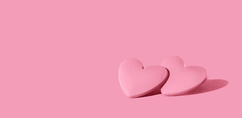 two pink hearts on pink background. Minimal monochrome for St Valentines day or 14 February. Mothers Day or wedding invitation - obrazy, fototapety, plakaty