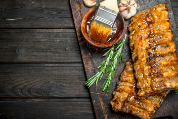 Grilled ribs with sauce, herbs and spices.