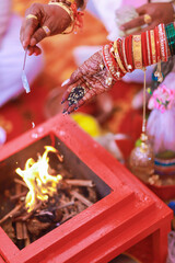 Traditional Indian wedding. In India , A Marathi wedding . Couple holding hands and performing...
