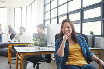 Obraz premium Woman, office portrait and smile by desk with business people, success and vision at web design company. Creative woman, motivation and modern office with career, goals and happy for job in New York