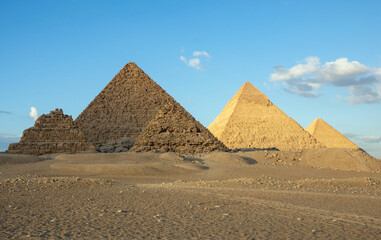 Fototapeta na wymiar All three main pyramids of Giza. Pyramid of Menkaure, of Khafre or Chephren, of Khufu or Cheops and smal Queen’s pyramids.