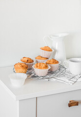 Simple pastries for dessert. Muffins with peanut paste on a white table