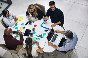 Meeting, planning and top view of a team in the office discussing company report or proposal....