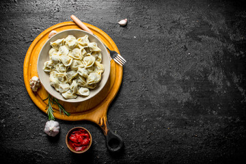 Dumplings with tomato paste, garlic and rosemary.