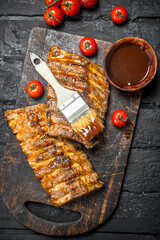 Grilled ribs with sauce.