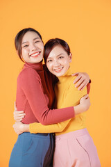 Naklejka premium Image of two young Asian woman on background