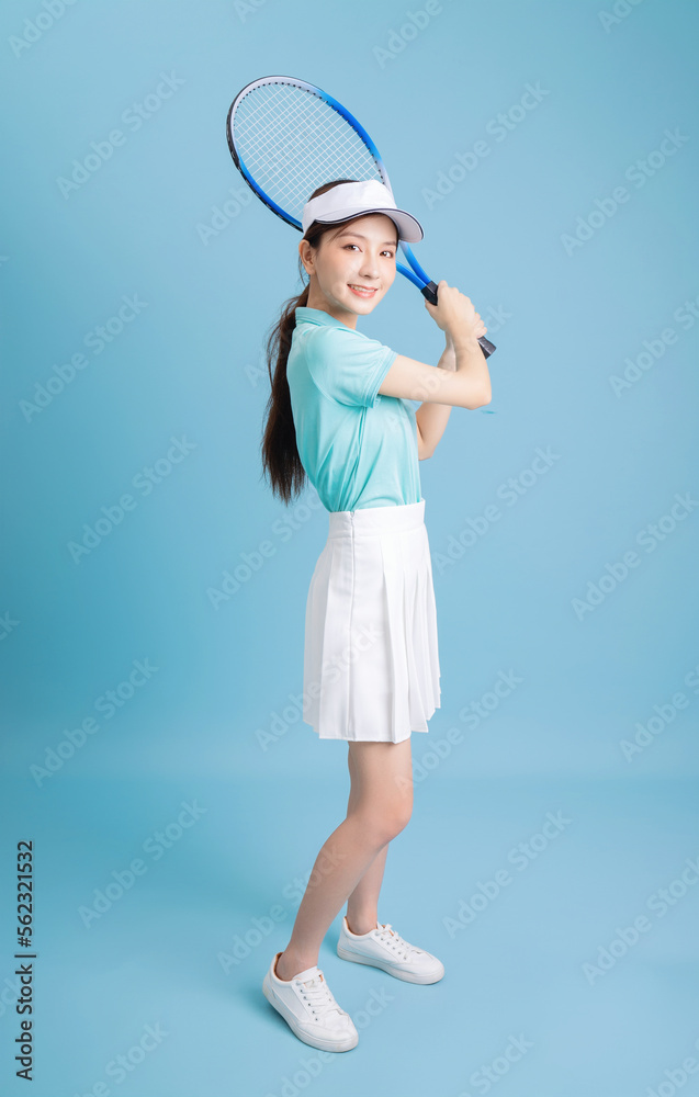 Poster image of young asian girl playing tennis