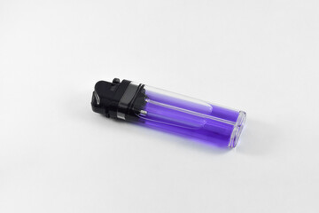 purple plastic gas lighter. Gas lighter isolated on a white background. Close up shot