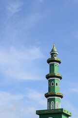 Fototapeta na wymiar Muslim Mosque. Domes and towers. with a blue sky background, Indonesian mosque