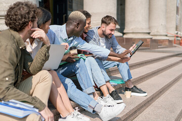 group of students discussing a group project .