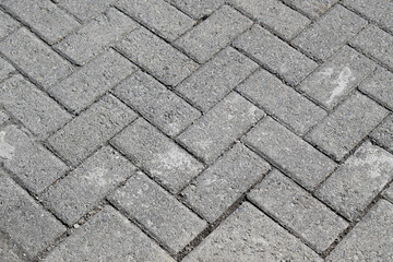 Paved tile texture at the bottom of the road. Concrete paving slab.With paving for corner